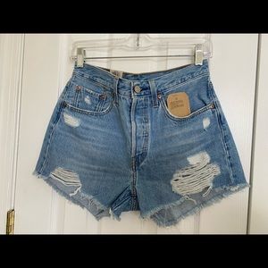 Distressed light denim women Levi 501 jean shorts